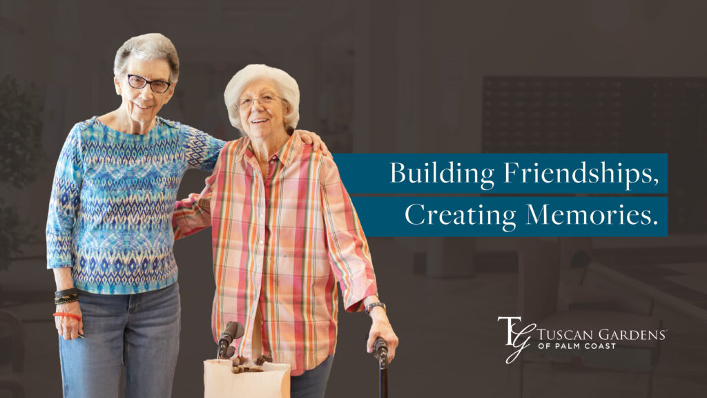 Two senior women standing together, smiling at Tuscan Gardens of Palm Coast Senior Living Community