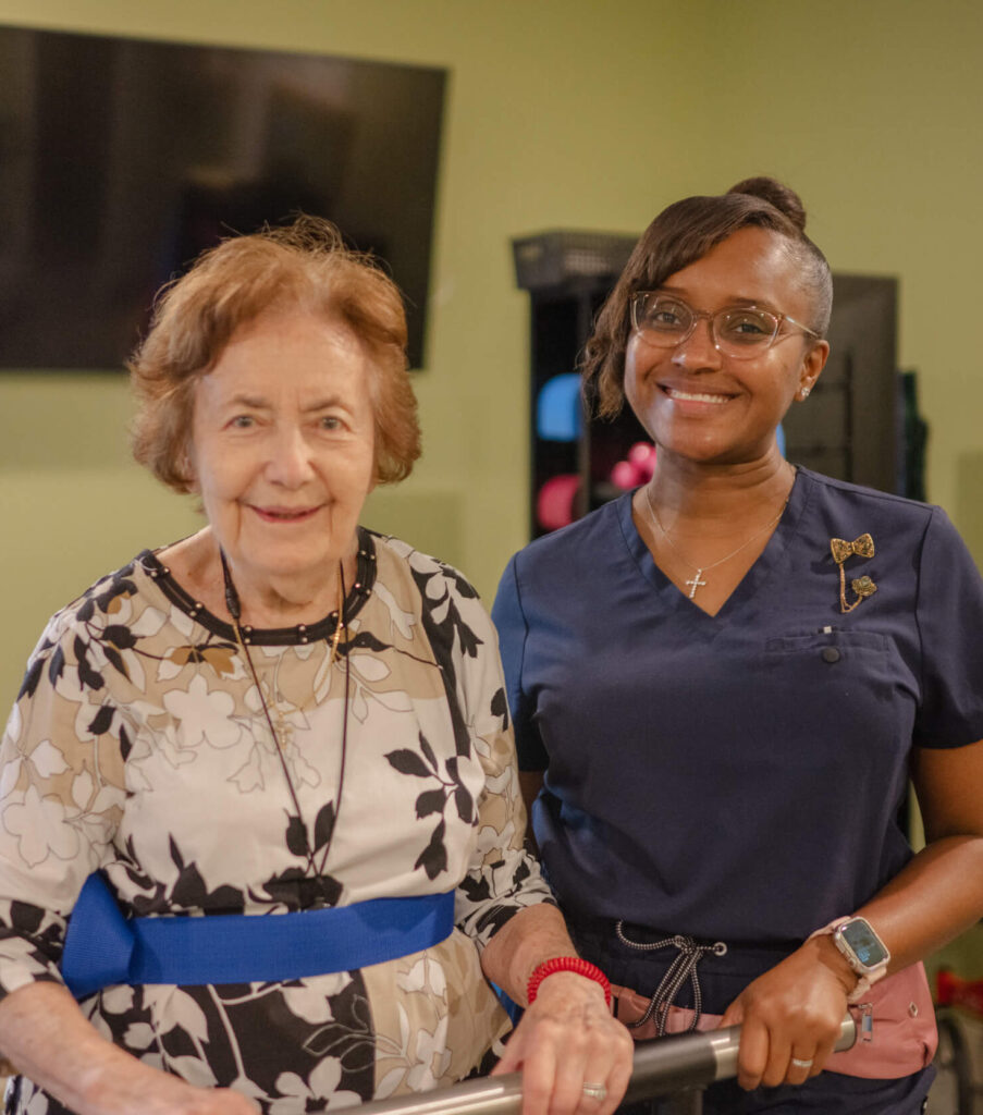 A senior women and caregiver smiling, celebrating the MVP Program.