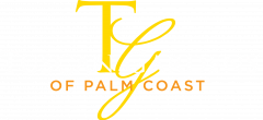 Tuscan Gardens of Palm Coast logo, located in the footer of the website page, featuring a stylized 'TG' in gold above the company name in white and gold text on a dark blue background