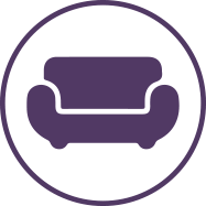 Icon of a couch inside a circle frame representing Inviting Great Rooms in the Memory Care amenities section