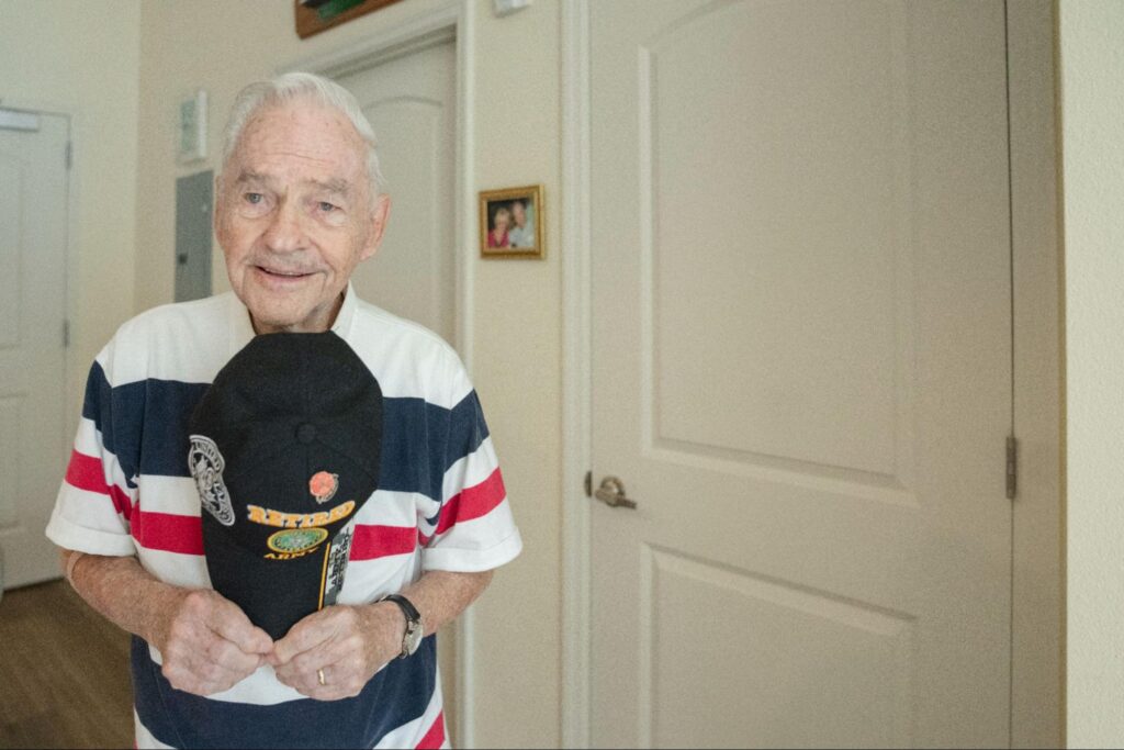 A Tuscan Gardens resident showing veteran badges